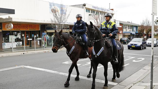 Mounted police officers patrol Bankstown streets near the mall. Picture: Sam Ruttyn