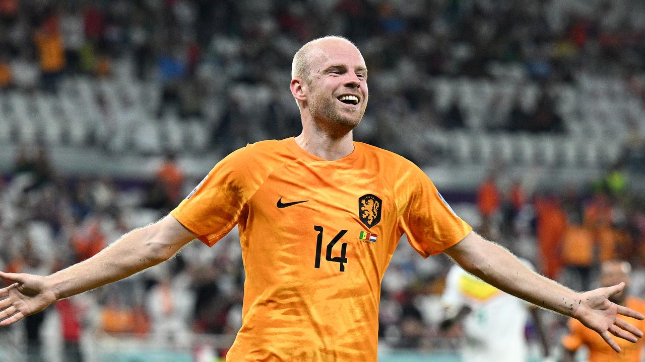 Davy Klaassen of Netherlands celebrates after scoring with a sparse grandstand behind him. Photo by Stuart Franklin/Getty Images.