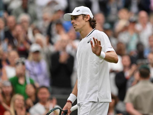 Australia's Alex de Minaur reacts after winning against France's Arthur Fils during their men's singles fourth round tennis match on the eighth day of the 2024 Wimbledon Championships at The All England Lawn Tennis and Croquet Club in Wimbledon, southwest London, on July 8, 2024. De Minaur won the match 6-2, 6-4, 4-6, 6-3. (Photo by Glyn KIRK / AFP) / RESTRICTED TO EDITORIAL USE