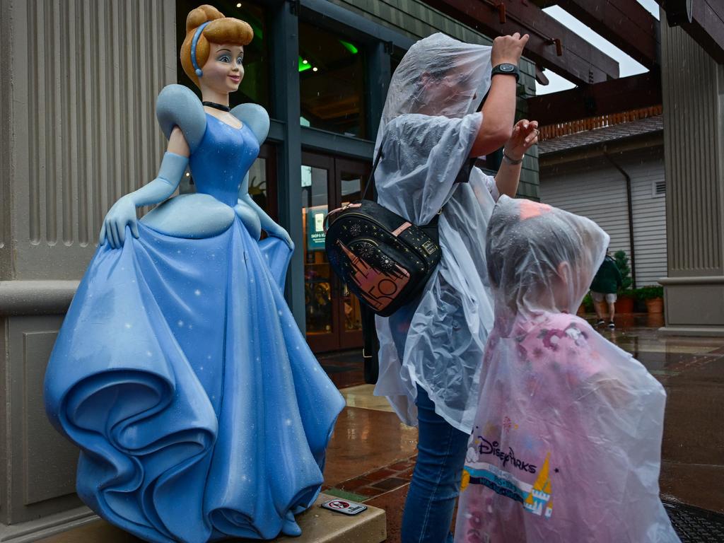 Visitors at the Disney Spring shopping centre wearing ponchos. Picture: Giorgio Viera/ AFP