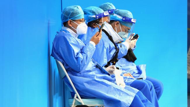 Medical personnel stand by during the USA Women's Olympic Hockey Team practice in Beijing. Picture: Bruce Bennett/Getty Images