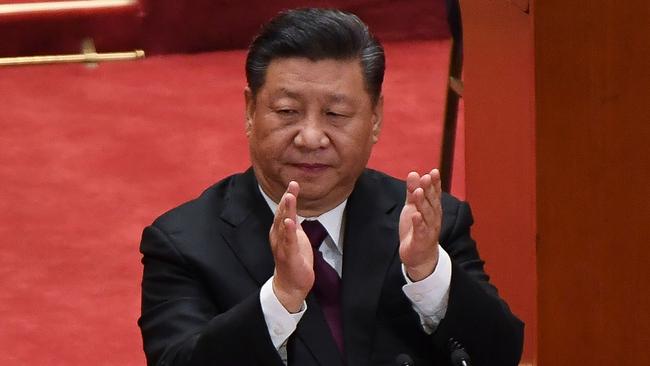 China's President Xi Jinping applauds during a celebration meeting marking the 40th anniversary of China's "reform and opening up" policy. Picture: AFP