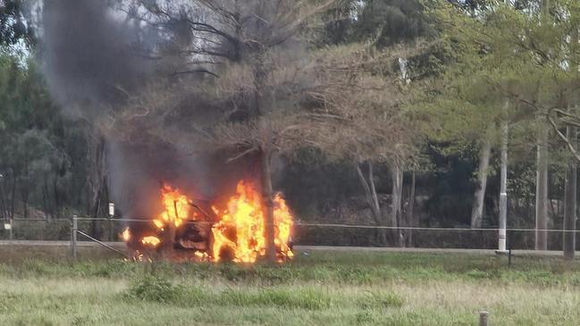 A stolen Grey Mazda BT-50 Dual Cab on fire in John Melton Black Dr, Townsville on Saturday. Picture: Facebook