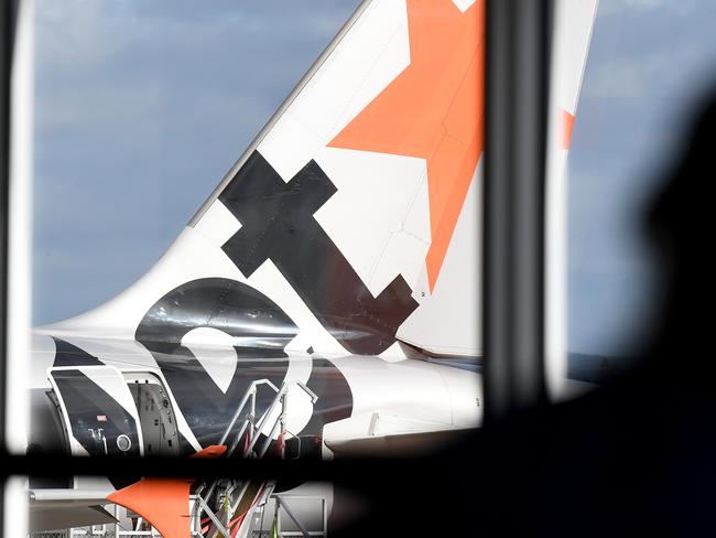 SYDNEY, AUSTRALIA - NCA NewsWire Photos JULY, 28, 2020: A Jetstar Aircraft is seen on the tarmac at Sydney Airport. An infectious woman who flew from Melbourne to Sydney, on Jetstar flight JQ506 on July 25th, has tested positive to COVID-19 (Coronavirus). Picture: NCA NewsWire / Bianca De Marchi