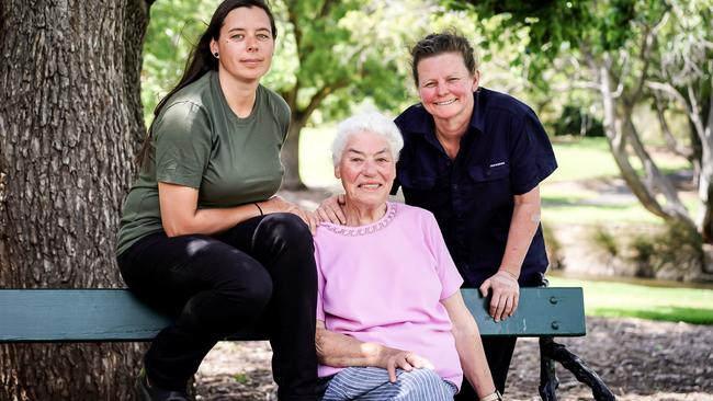 Artists Christine Cholewa, left, and Deb Jones, right, with 87-year-old domestic violence survivor and activist Helen Oxenham. Picture: AAP / Mike Burton