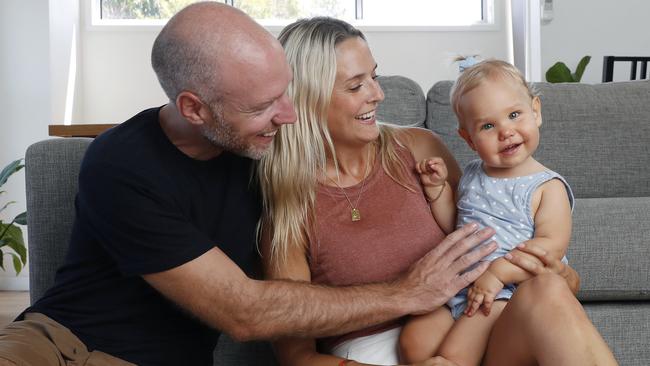 Erin and David Oudshoorn with their daughter Luella, 17 months, who has a rare form of epilepsy which they treat with medical cannabis oil. Picture: David Swift