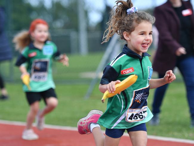 These Little Athletics legends have the right idea: use your banana as a baton before break time. Picture: supplied