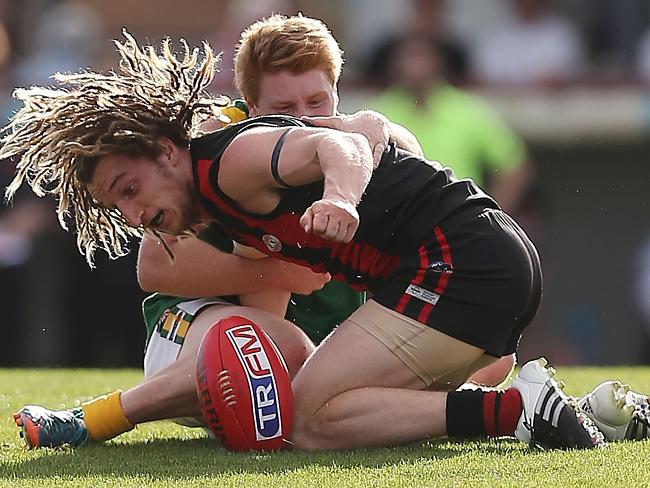 Gippsland Football League Grand Final match between Maffra Eagles and Leongatha Parrots. Maffra became the 2016 premiers, defeating Leongatha 13.10 (88) to 9. 16 (67). Danny Butcher and Matthew Borschman get on the ground to get the ball. Picture: Yuri Kouzmin