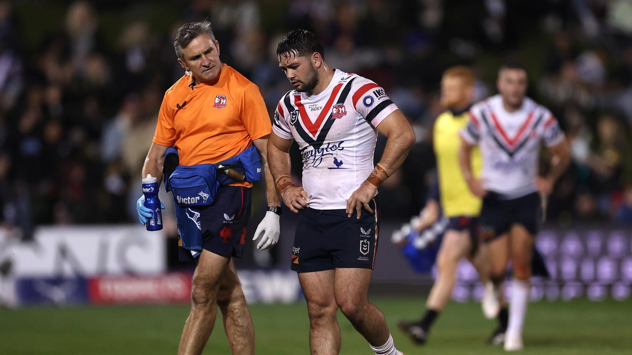 PENRITH, AUSTRALIA - MAY 12: Brandon Smith of the Roosters is attended to by a trainer during the round 11 NRL match between the Penrith Panthers and Sydney Roosters at BlueBet Stadium on May 12, 2023 in Penrith, Australia. (Photo by Mark Kolbe/Getty Images)