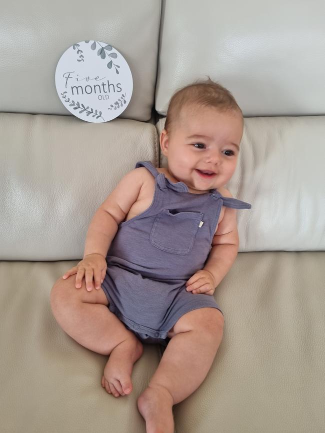 Huxley Harris. Six months old. Smiley and cheeky little babe with chubby cheeks, two little teeth and a smile that melts your heart.