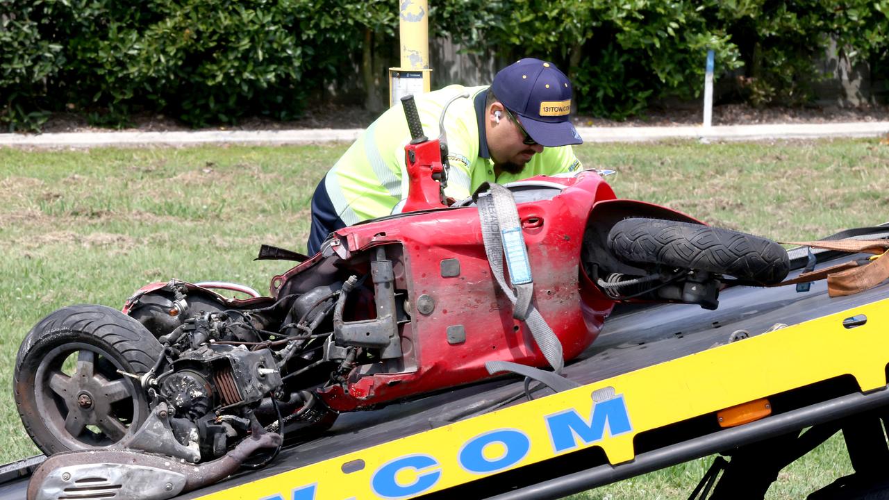 Michael Warburton’s scooter is loaded onto a tow track in Brisbane’s east on Monday. Picture: Steve Pohlner