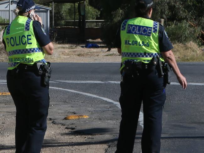 ADELAIDE, AUSTRALIA - Advertiser Photos APRIL 2, 2021: Major Crash Investigators, Police and Emergency service crews at the scene of a serious car crash on the corner of Wingate Road, Angle Vale Road and Dalkeith Rd Hillier, SA.Just before 7.45am on Saturday 3 April, police were called to Angle Vale Road near intersection of Dalkeith and Andrews Road after a car hit a tree. The driver of the vehicle has sustained serious injuries. Police are currently directing traffic around the crash site, Angle Vale Road has been closed to all traffic. Picture: Emma Brasier