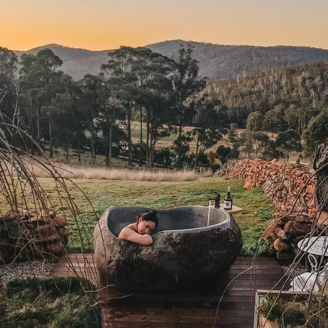 A guest enjoys the changing colours of the sky at Luna Lodge. Picture: Andrea Marie Chu