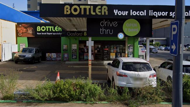 Katrina Charge was charged with smashing the glass door of this Gosford bottle shop trying to get to her then boyfriend inside. Picture: Google