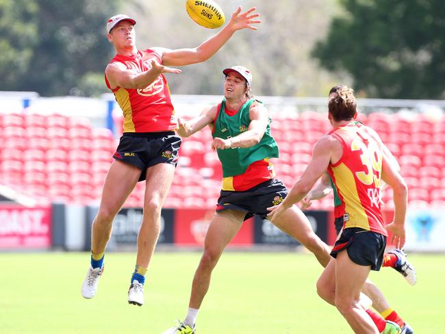 Peter Wright (left) in action during Gold Coast training. Picture: Adam Head