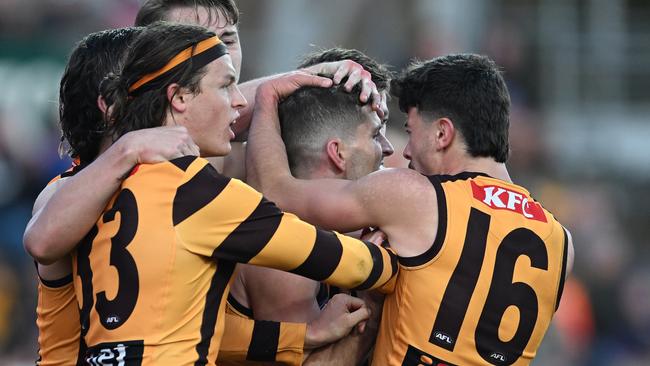 LAUNCESTON, AUSTRALIA - JUNE 08: Luke Breust of the Hawks is congratulated by teammates during the round 13 AFL match between Hawthorn Hawks and GWS GIANTS at University of Tasmania Stadium, on June 08, 2024, in Launceston, Australia. (Photo by Steve Bell/Getty Images)