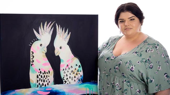 Local young artist Cinta Rose with one of her artworks for the Dream Big exhibition. Photo: Supplied