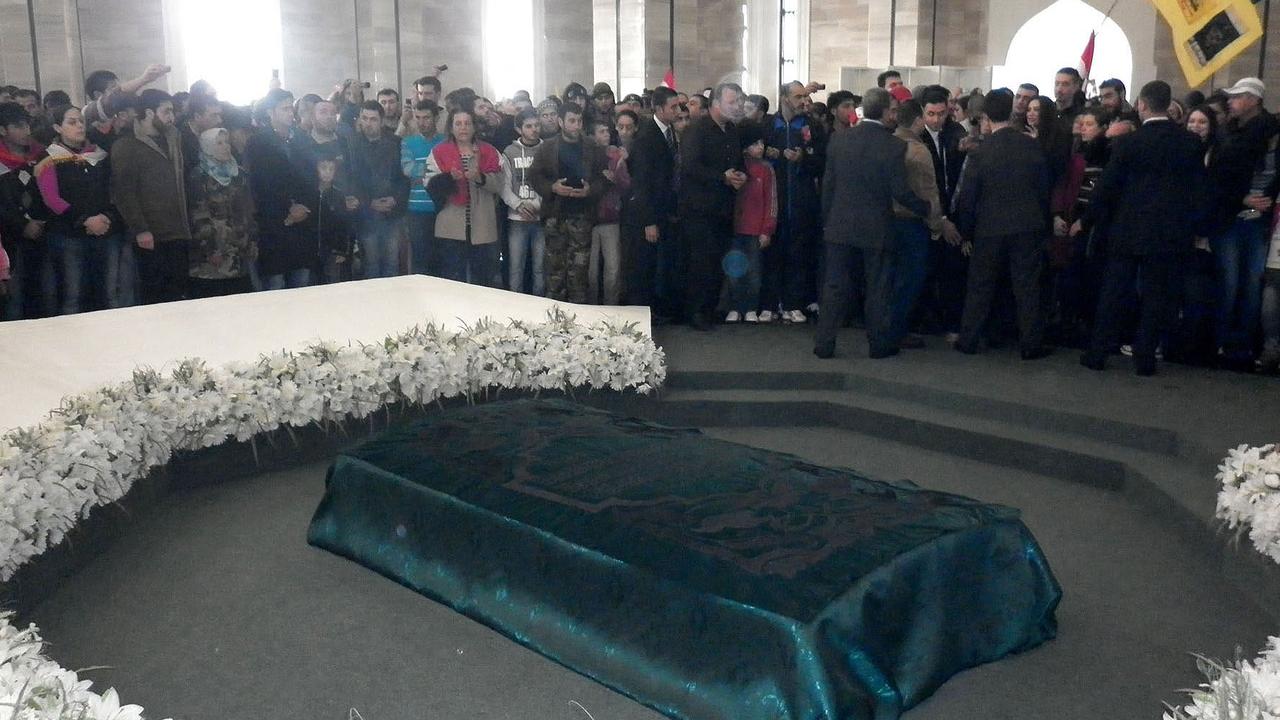 Syrians visiting the gravesite of Syria's late leader Hafez al-Assad on November 16, 2011. Picture: AFP/ HO/ SANA