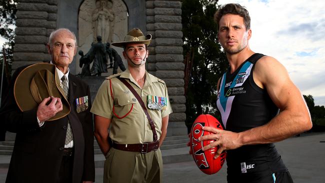 Port Adelaide’s Travis Boak with Private Lindsay McGie, who served in Vietnam, and Infantry Captain Brett Edmonds ahead of a previous Anzac Day game. Picture: Sarah Reed