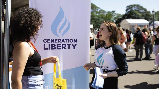 Generation Liberty campus co-ordinator Laura Glase, right, at a stall at the University of Sydney. The group has been blocked from similar activities at Monash University.