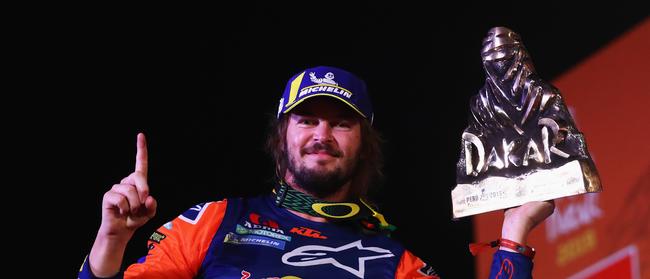 Toby Price of Australia from the KTM Factory Racing Team No. 3 Motorbike celebrates victory and his 1st palce on the podium after Stage Ten and the finish of the 2019 Dakar Rally at Magdalena Beach or Playa on January 17, 2019 in Lima, Peru. Picture: Dean Mouhtaropoulos/Getty Images.