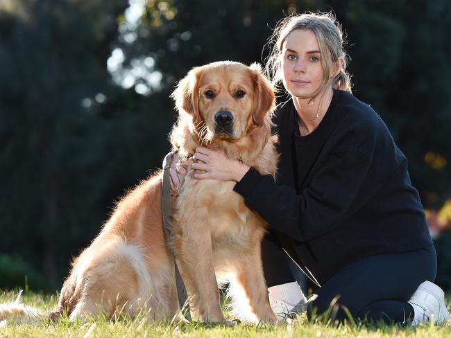 Maddy Robin with her dog Lenny who was recently struck by gastro. Picture: Josie Hayden