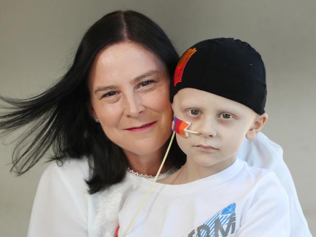 8-year-old Wakerley boy Richie Walsh was diagnosed with a rare cancer called Rhabdomyosarcoma. Mum n dad Karl and Lisa and son Luke 20yrs all Walsh. Pic Annette Dew