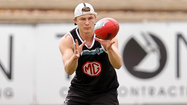 Port Adelaide players have also returned as Xavier Duursma gets to work.