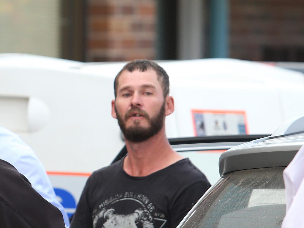 Farm labourer Robert Trebeck 33 brought into the Bowen Police Station after his arrest. Photo Ric Frearson