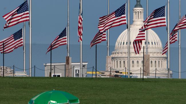 Flags fly at half-mast for John McCain in Washington yesterday. Picture: AFP