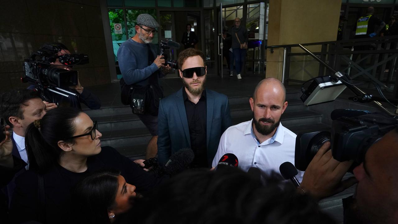 Mr Sewell addresses media outside of court alongside Joel Davies. Picture: NewsWire / Luis Enrique Ascui