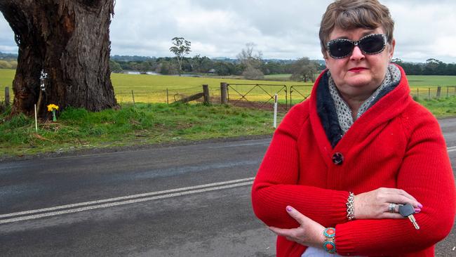 Danny Frawley’s cousin, Cindy O'Connor, lays a tribute at the scene near Ballarat. Picture: Jay Town