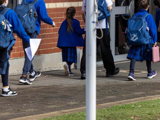 ADELAIDE, AUSTRALIA - NewsWIRE Photos AUGUST 22, 2023: Students return to East Adelaide School in St PeterÃs Adelaide, after families were advised to keep children at home after it received a bomb threat via email. Picture: NCA NewsWIRE / Emma Brasier