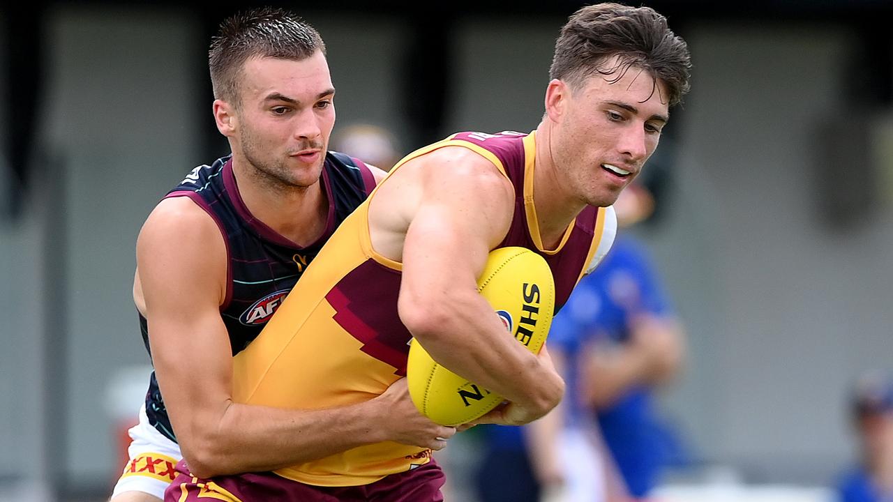 Noah Answerth is tackled by Darcy Wilmot. Picture: Bradley Kanaris/Getty Images