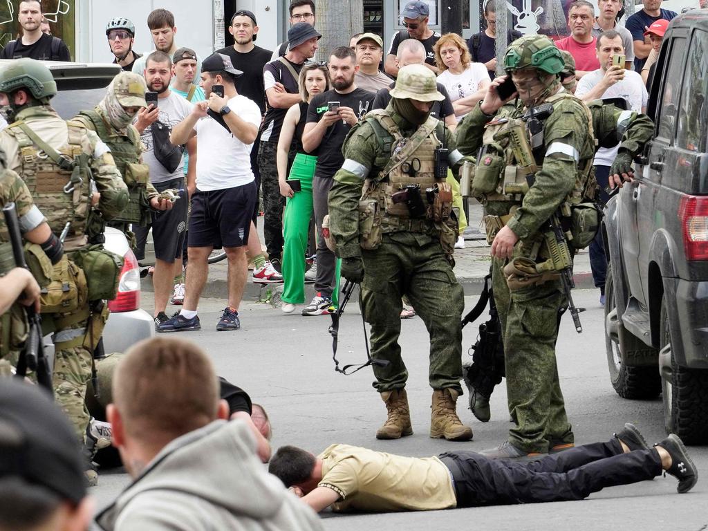 Members of the Wagner group detain a man in the city of Rostov-on-Don, on June 24, 2023. Picture: AFP