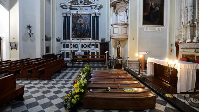 Coffins lined up inside a church in Serina, near Bergamo, northern Italy.