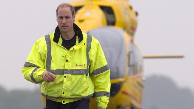 William on the job with the East Anglian Air Ambulance at Cambridge Airport, 2015. The former RAF search and rescue helicopter pilot worked as a co-pilot transporting patients to hospital from emergencies ranging from road accidents to heart attacks. Picture: AFP