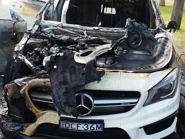 A white Mercedes believed to have been used as a getaway car by the Bankstown shooters was found burnt out in Greenacre this afternoon. Picture: Channel 7