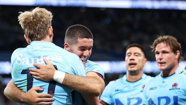 Max Jorgensen celebrates with Ben Donaldson after scoring a try on debut. Pic: Mark Kolbe/Getty Images