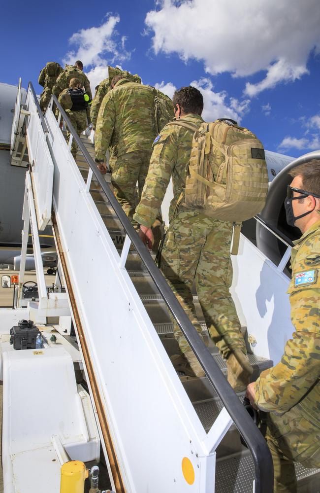 Air force and Army personnel board a waiting KC-30A Multi-Role Tanker Transport aircraft at RAAF Base Amberley bound for the Middle East.