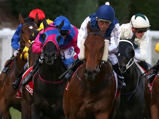 Damien Oliver (blue cap) rides Pearl De Vere to victory in the Art Series Hotel Group plate, during the Ladbrokes Friday Night Lights at the Moonee Valley Racecourse in Melbourne, Friday, November 17, 2017. (AAPImage/George Salpigtidis)  NO ARCHIVING, EDITORIAL USE ONLY