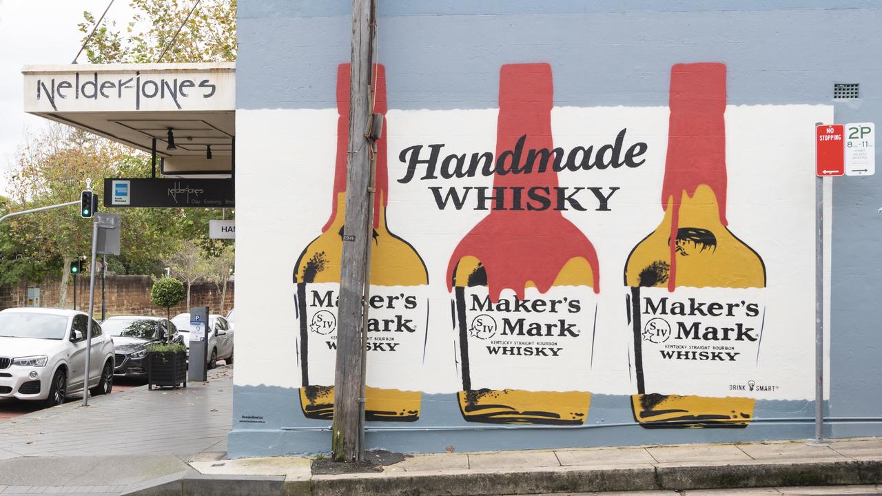 The wall now sports a whisky ad. Picture: NCA NewsWire / Monique Harmer