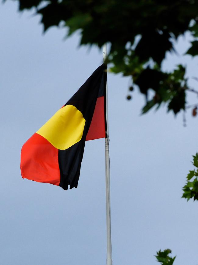 The Aboriginal flag is seen at the Victorian Parliament building. Picture: NCA NewsWire / Luis Enrique Ascui