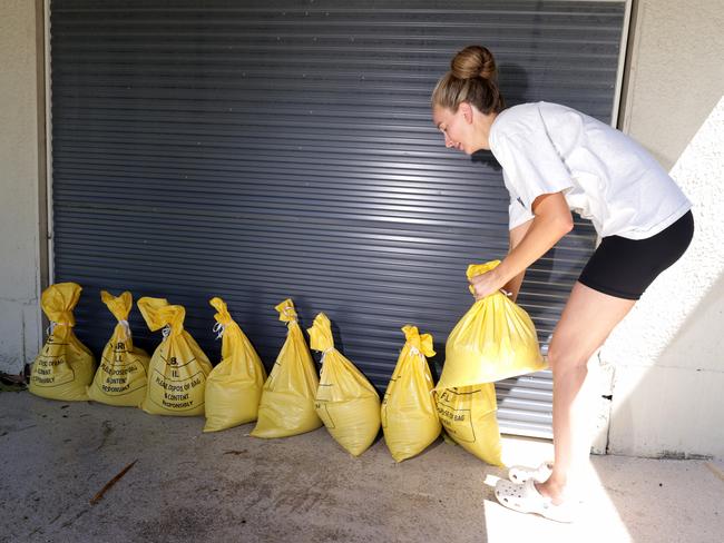 A residents sandbags ahead of Cyclone Alfred. Picture: Steve Pohlner