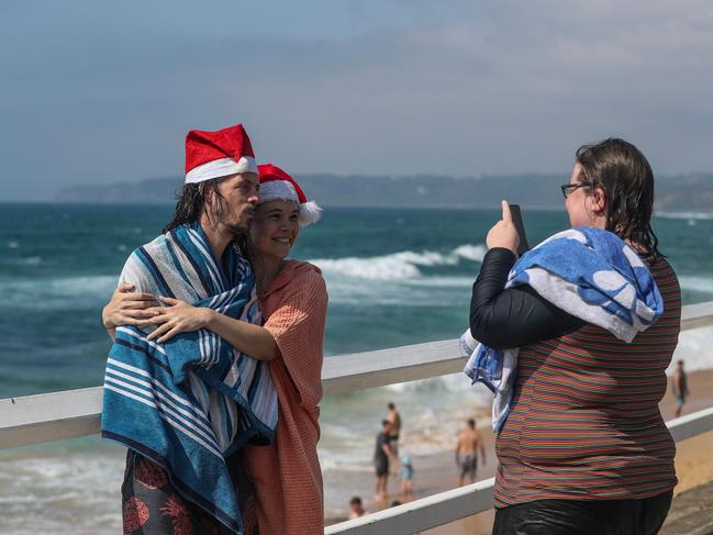 Newcastle: Bar Beach-goers getting festive. Picture: Roni Bintang/Getty Images