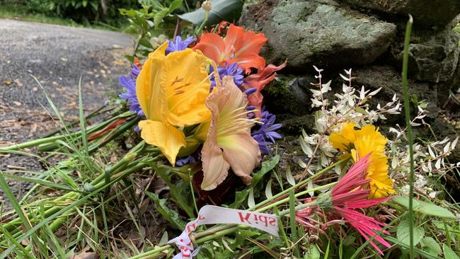 Flowers have been left at the entrance to a Goonengerry property where twin girls died on Sunday. Picture: Cath Piltz