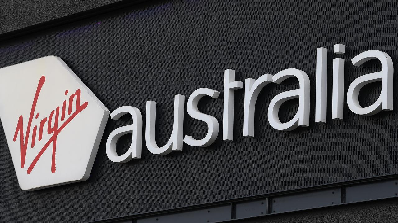 Signage for Virgin Australia is seen at Melbourne Airport in Melbourne, Monday, April 20, 2020. (AAP Image/James Ross) NO ARCHIVING