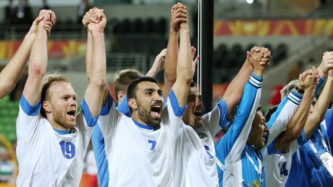 Uzbekistan v Saudi Arabia Asian Cup, Group B. at the Melbourne Rectangular Stadium, 18th January. VITALIY DENISOV and AZIZBEK HAYDAROV of Uzbekistan celebrate the win with the fans. Picture : George Salpigtidis