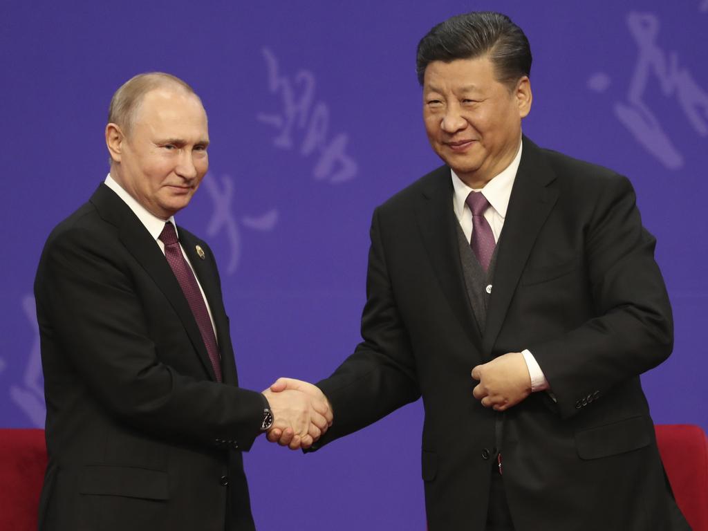 Mr Cameron took a swipe at Russian President Vladimir Putin, left, and Chinese President Xi Jinping, right. Picture: Kenzaburo Fukuhara – Pool/Getty Images