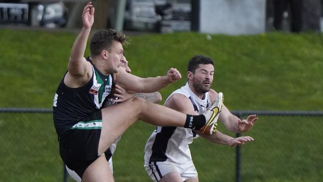 EFL: Donvale’s Jake McCormack gets a kick away under pressure. Picture: Valeriu Campan